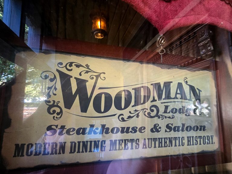 Woodman Lodge Restaurant Steakhouse and Bar logo - Snoqualmie WA