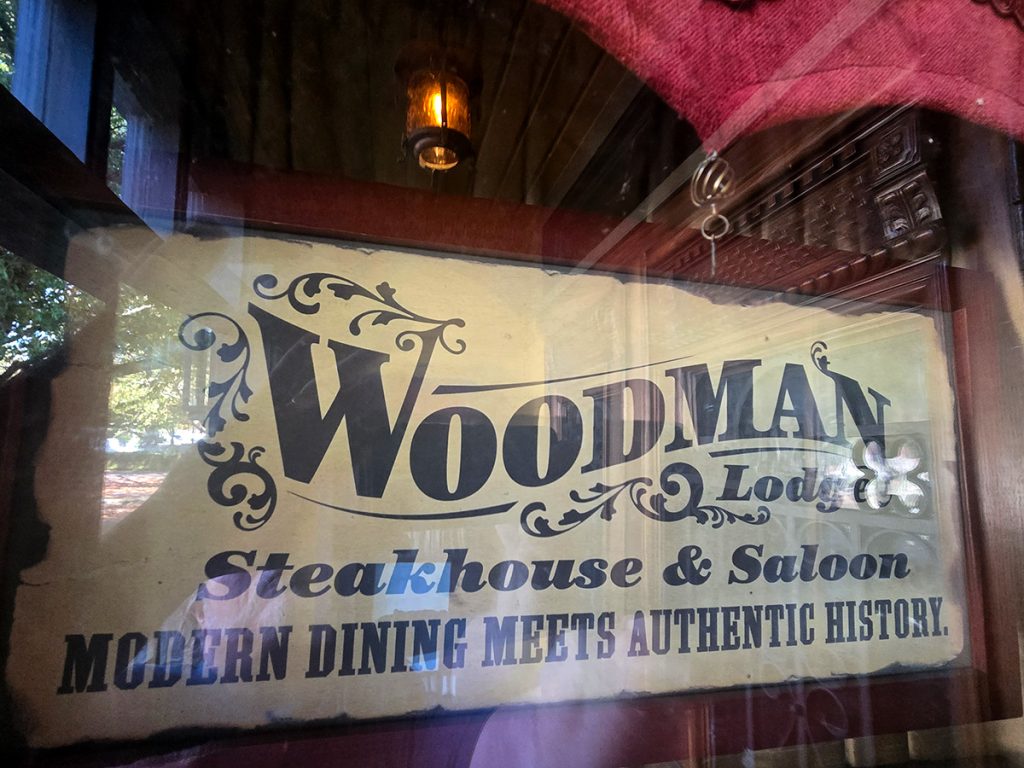 Woodman Lodge Restaurant Steakhouse and Bar logo - Snoqualmie WA